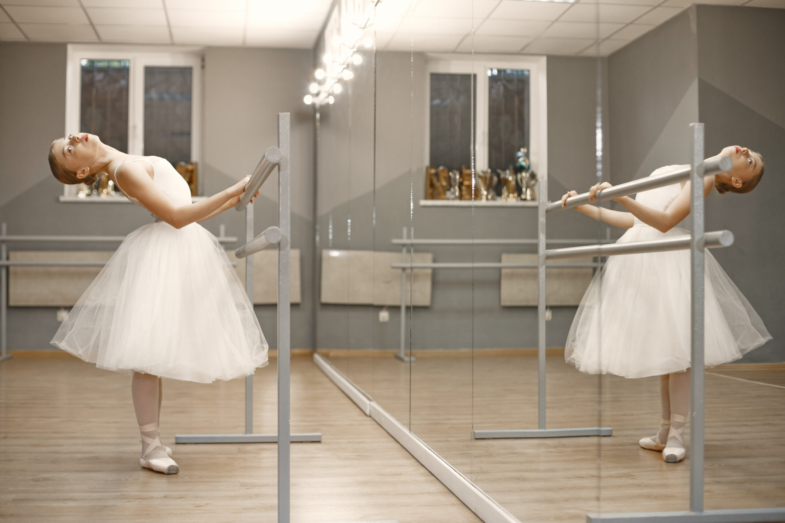 ballerina posing in front of white background